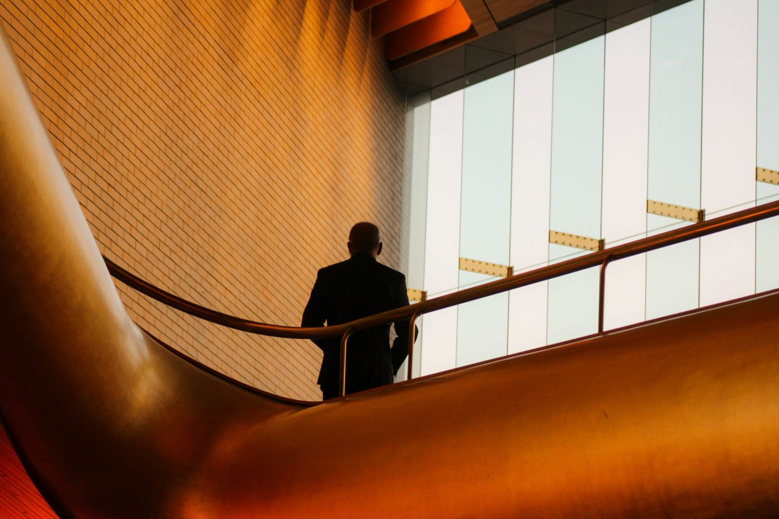 A silhouette of a man standing in front of a window. Credit: taylor-nicole-qH7nLsK_IjE-unsplash